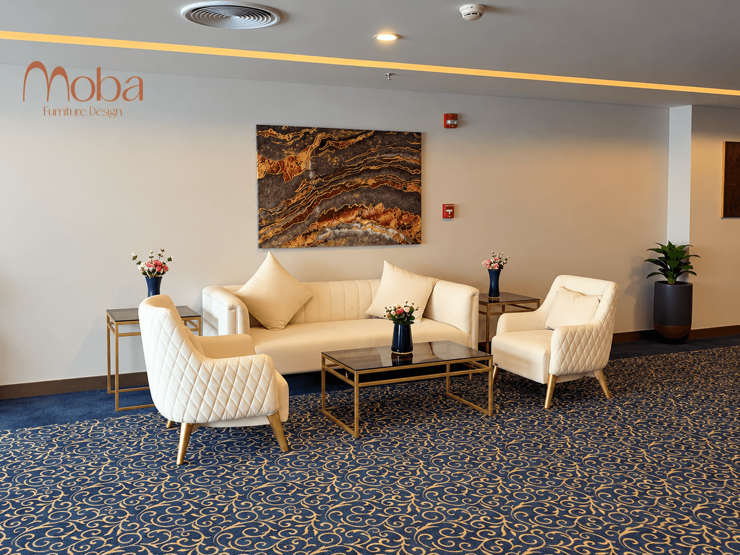 Hotel lounge seating area with cream tufted sofa, matching armchairs and glass-top coffee table – Moba Furniture