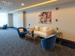 Hotel lounge with blue velvet armchairs – Moba Furniture