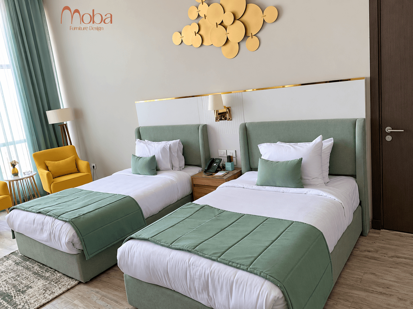 Hotel twin room with sage-green upholstered beds – Moba Furniture