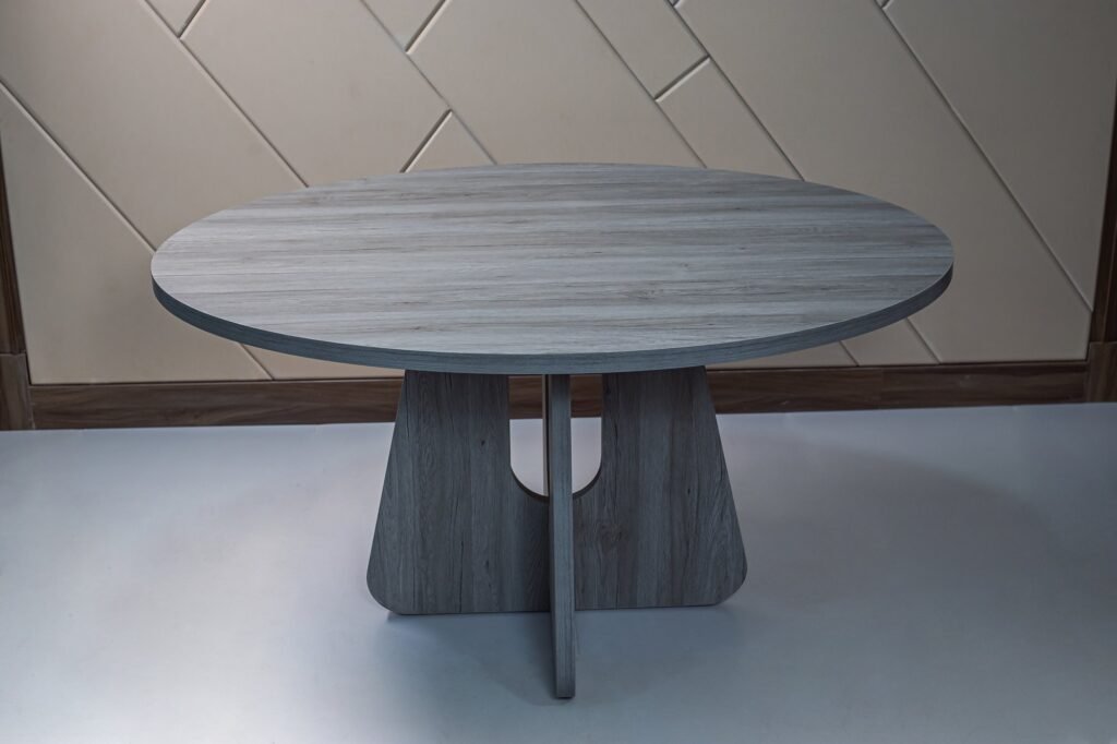 Large Grey Round Dining Table with Cut-Out Cross Base - صورة 4